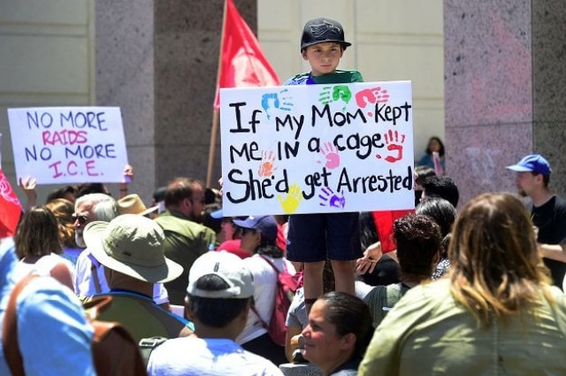 in this file photo taken on june 30 2018 people hold placards during a 039 families belong together 039 march and rally in los angeles california where a thousands turned out to decry the trump administration 039 s detention of families policy at the us mexico border photo afp in this file photo taken on june 30 2018 people hold placards during a 039 families belong together 039 march and rally in los angeles california where a thousands turned out to decry the trump administration 039 s detention of families policy at the us mexico border photo afp