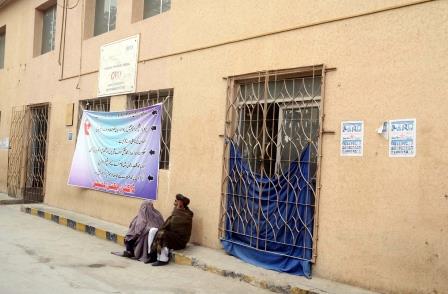 an elderly man and a women sit outside the closed out patient department of quetta civil hospital photo ppi