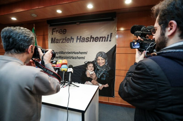 journalists in tehran photograph and film a poster calling for the release of marzieh hashemi a us born presenter for iran 039 s press tv who was arrested on a visit to her birth country photo afp journalists in tehran photograph and film a poster calling for the release of marzieh hashemi a us born presenter for iran 039 s press tv who was arrested on a visit to her birth country photo afp