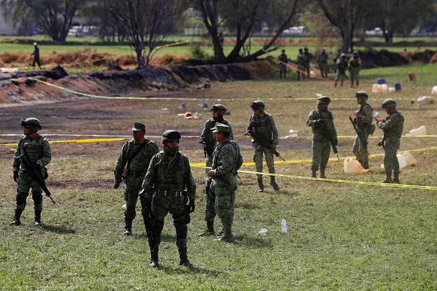 soldiers keep watch at the site where a fuel pipeline ruptured by suspected oil thieves exploded in the municipality of tlahuelilpan state of hidalgo mexico january 19 2019 photo reuters