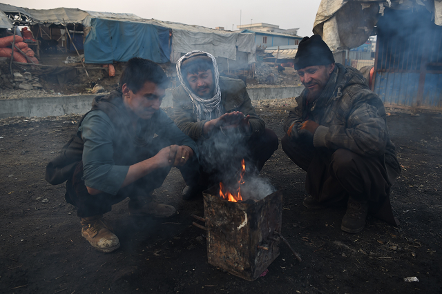 the choking contamination peaks in evenings and early mornings when temperatures plunge below zero photo afp