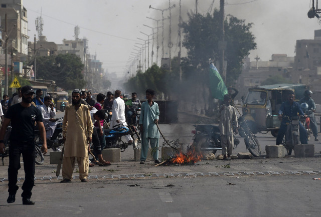 tlp supporters on a blocked street during protests photo afp tlp supporters on a blocked street during protests photo afp