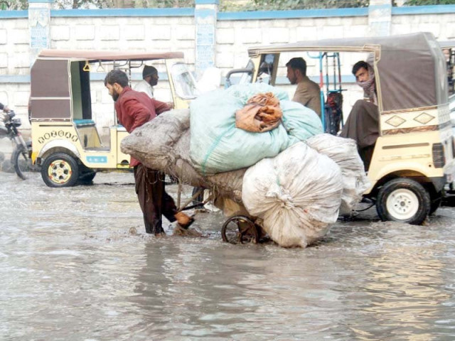 karachiites struggled to traverse overflowing roads on monday after the first downpour of the winter season photos online karachiites struggled to traverse overflowing roads on monday after the first downpour of the winter season photos online