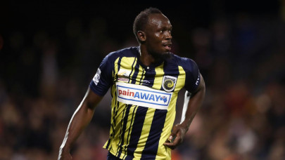 bolt hanging up boots on football dream