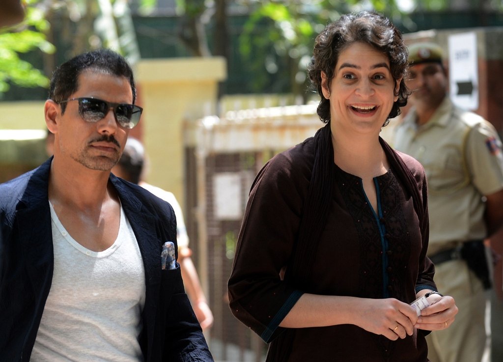 this file photo taken on april 10 2014 shows priyanka gandhi r daughter of india 039 s congress party president sonia gandhi and her husband robert vadra arriving at a polling station to cast their votes in new delhi photo afp