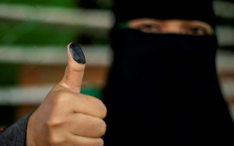 a woman shows her inked thumb at a voting precinct in cotabato on the southern philippine island of mindanao on january 21 2019 during a vote on giving the nation 039 s muslim minority greater control over the region photo afp