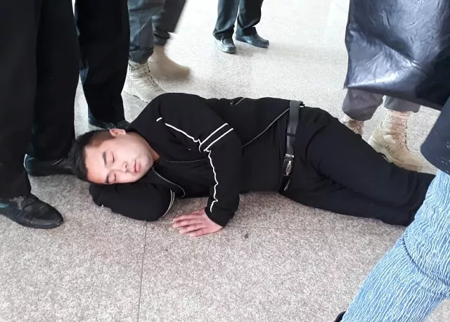 two chinese nationals lie down on floor blocking exit of international arrivals lounge at islamabad airport photo express two chinese nationals lie down on floor blocking exit of international arrivals lounge at islamabad airport photo express