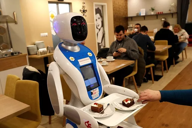 a robot waiter serves customers at a cafe in budapest hungary january 24 2019 photo reuters a robot waiter serves customers at a cafe in budapest hungary january 24 2019 photo reuters