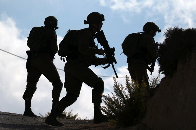 israeli soldiers pictured following clashes between israeli settlers from the settlement of yitzhar and palestinians from nearby urif village south of nablus in the west bank on october 10 2018 photo afp israeli soldiers pictured following clashes between israeli settlers from the settlement of yitzhar and palestinians from nearby urif village south of nablus in the west bank on october 10 2018 photo afp