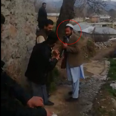 man circled in red accidentally shoots himself during celebratory firing