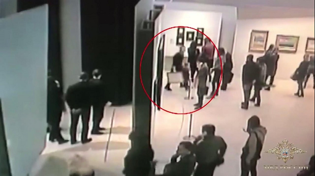 an image grab taken from a video footage released by the russian interior ministry on january 28 2018 shows a man stealing a famous painting by arkhip kuindzh during an exhibition at the tretyakov gallery in moscow on january 27 2018 photo afp