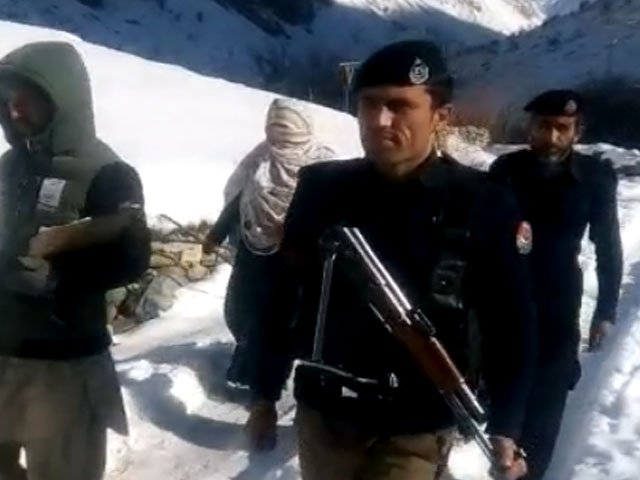 amid freezing temperatures polio workers go door to door administering polio drops to the children photo screengrab