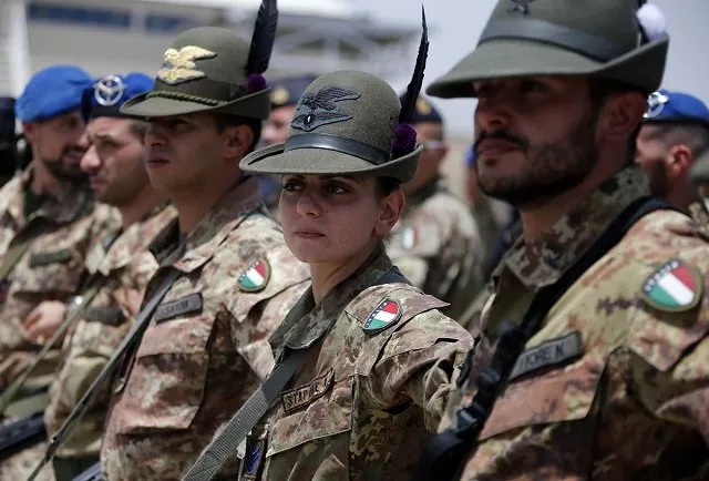 italian armed force soldiers of the mountain unit alpini stand in line at the herat airfield photo reuters italian armed force soldiers of the mountain unit alpini stand in line at the herat airfield photo reuters