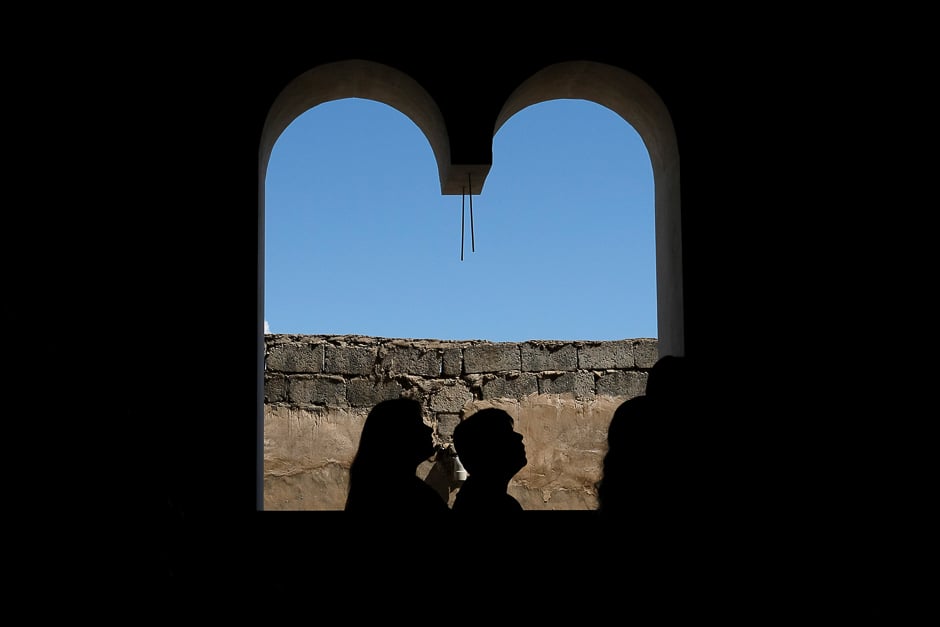 Believers take part in the Easter Mass in Mar Gewargis (St George) Chaldean Catholic church, which was damaged by Islamic State militants, in the town of Tel Esqof, Iraq. PHOTO: REUTERS