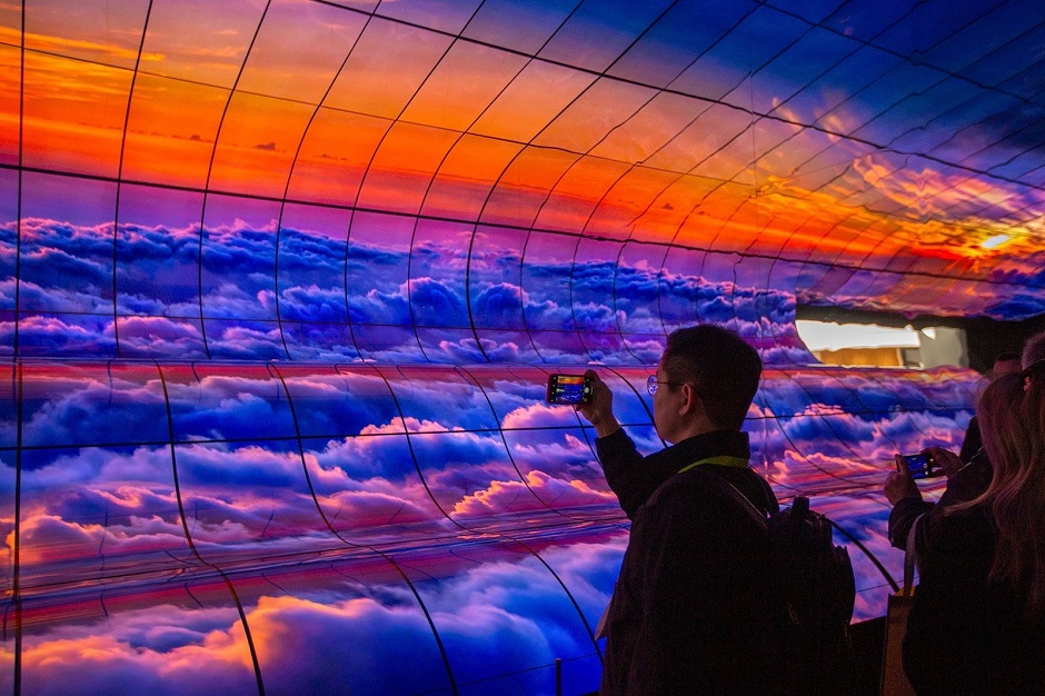 people take smartphone pictures of a large panel of curved lg oled tvs at ces international in las vegas photo afp