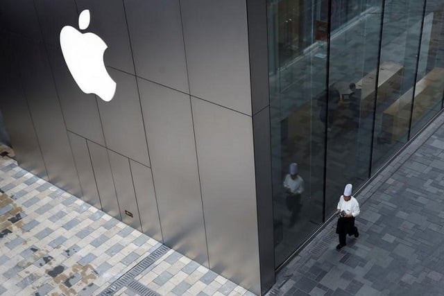 a chef walks past an apple store in beijing china january 7 2019 photo eurters a chef walks past an apple store in beijing china january 7 2019 photo eurters