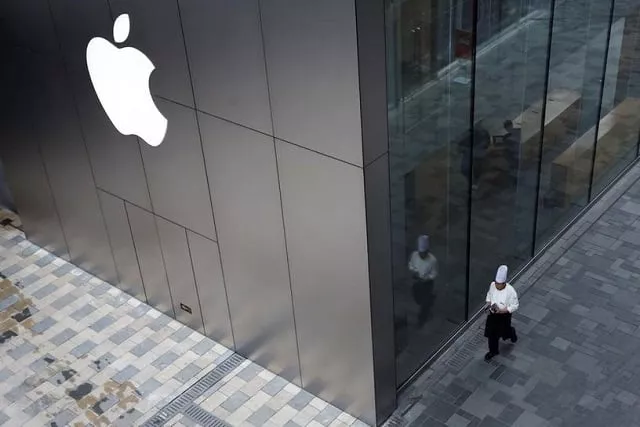 a chef walks past an apple store in beijing china january 7 2019 photo eurters a chef walks past an apple store in beijing china january 7 2019 photo eurters