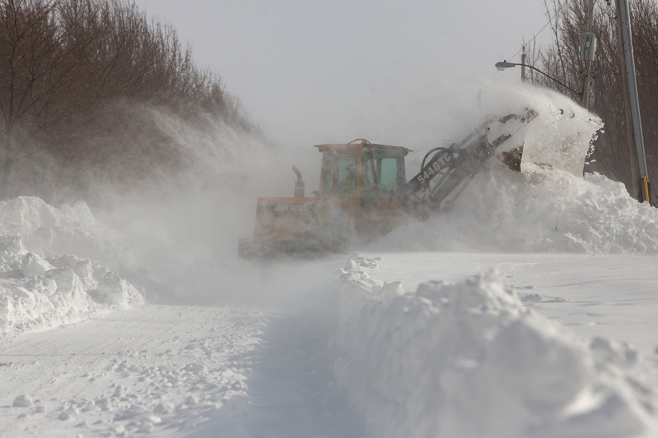 a city worker removes snow during the polar vortex in buffalo new york us photo reuters