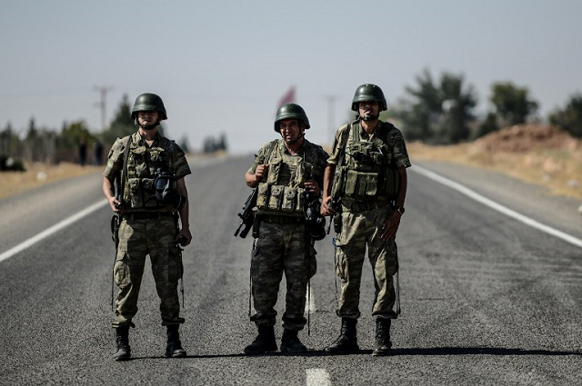 illustrative image of turkish soldiers standing guard near the turkish syrian border on september 4 2015 photo afp