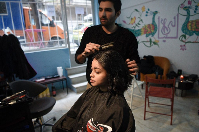 manassif raza opened his own hair salon in athens after escaping poverty in pakistan photo afp manassif raza opened his own hair salon in athens after escaping poverty in pakistan photo afp