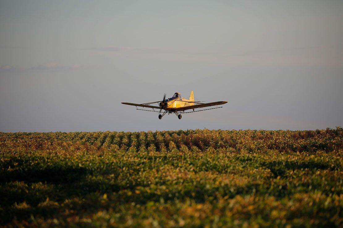 a crop duster plane sprays a field photo reuters