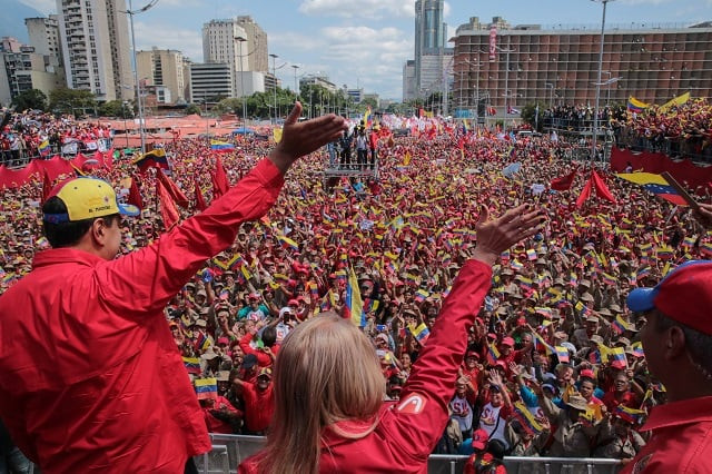 handout picture released by the venezuelan presidency showing venezuelan president nicolas maduro l and his wife cilia flores wave at the crowd during a gathering to mark the 20th anniversary of the rise of power of the late hugo chavez the leftist firebrand who installed a socialist government in caracas on february 2 2019 protesters flowed into the streets of caracas saturday with flags and placards many to support opposition leader juan guaido 039 s calls for democratic elections and others to back embattled president nicolas maduro photo afp handout picture released by the venezuelan presidency showing venezuelan president nicolas maduro l and his wife cilia flores wave at the crowd during a gathering to mark the 20th anniversary of the rise of power of the late hugo chavez the leftist firebrand who installed a socialist government in caracas on february 2 2019 protesters flowed into the streets of caracas saturday with flags and placards many to support opposition leader juan guaido 039 s calls for democratic elections and others to back embattled president nicolas maduro photo afp