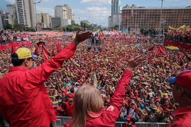 handout picture released by the venezuelan presidency showing venezuelan president nicolas maduro l and his wife cilia flores wave at the crowd during a gathering to mark the 20th anniversary of the rise of power of the late hugo chavez the leftist firebrand who installed a socialist government in caracas on february 2 2019 protesters flowed into the streets of caracas saturday with flags and placards many to support opposition leader juan guaido 039 s calls for democratic elections and others to back embattled president nicolas maduro photo afp handout picture released by the venezuelan presidency showing venezuelan president nicolas maduro l and his wife cilia flores wave at the crowd during a gathering to mark the 20th anniversary of the rise of power of the late hugo chavez the leftist firebrand who installed a socialist government in caracas on february 2 2019 protesters flowed into the streets of caracas saturday with flags and placards many to support opposition leader juan guaido 039 s calls for democratic elections and others to back embattled president nicolas maduro photo afp