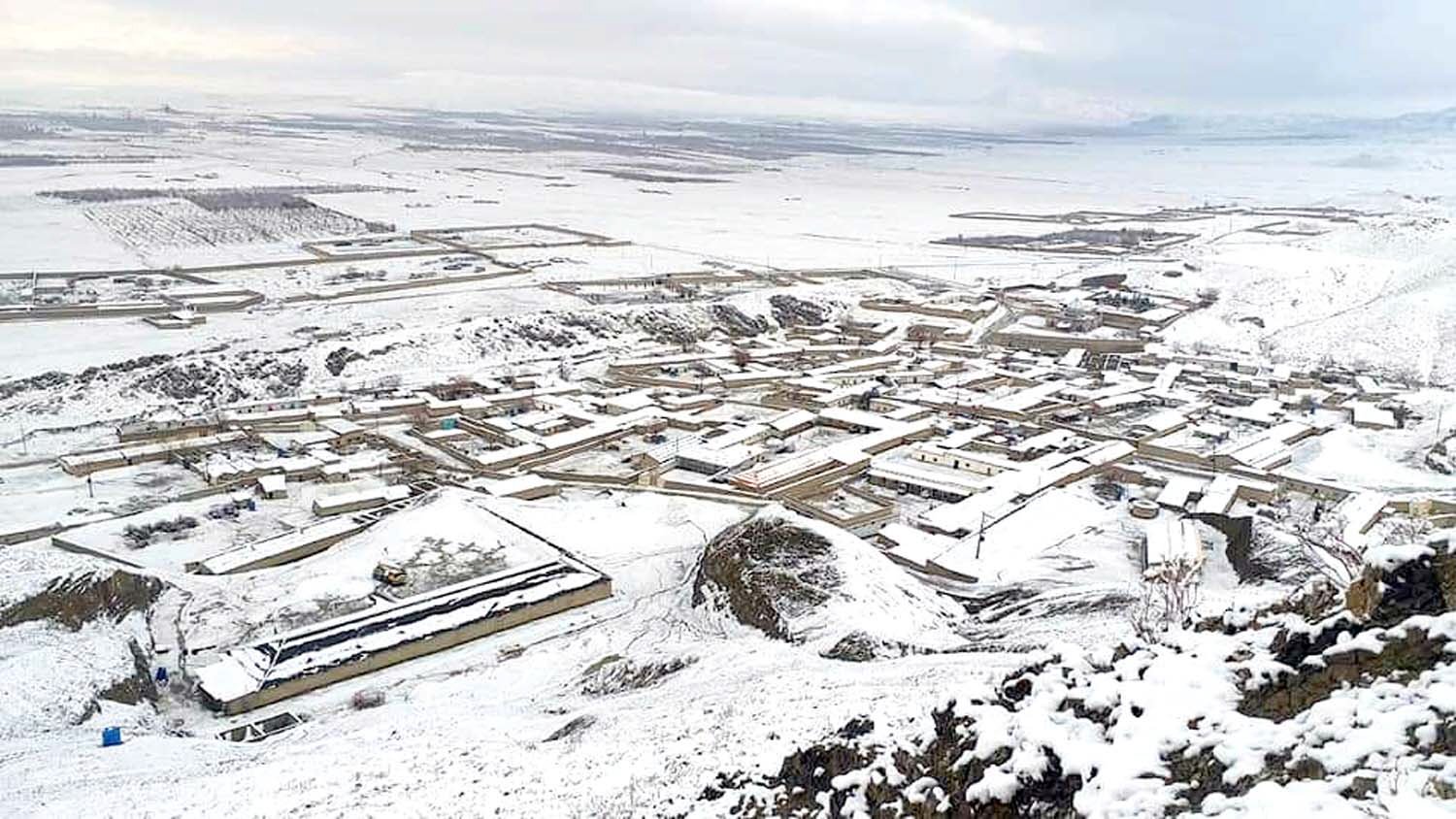 a beautiful snow covered view of khanozai in pishin district photo express