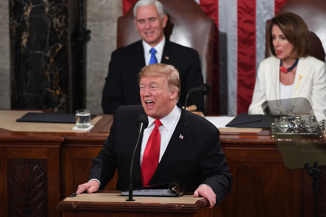 us president donald trump flanked by us vice president mike pence l and speaker of the us house of representatives nancy pelosi delivers the state of the union address at the us capitol in washington dc photo afp