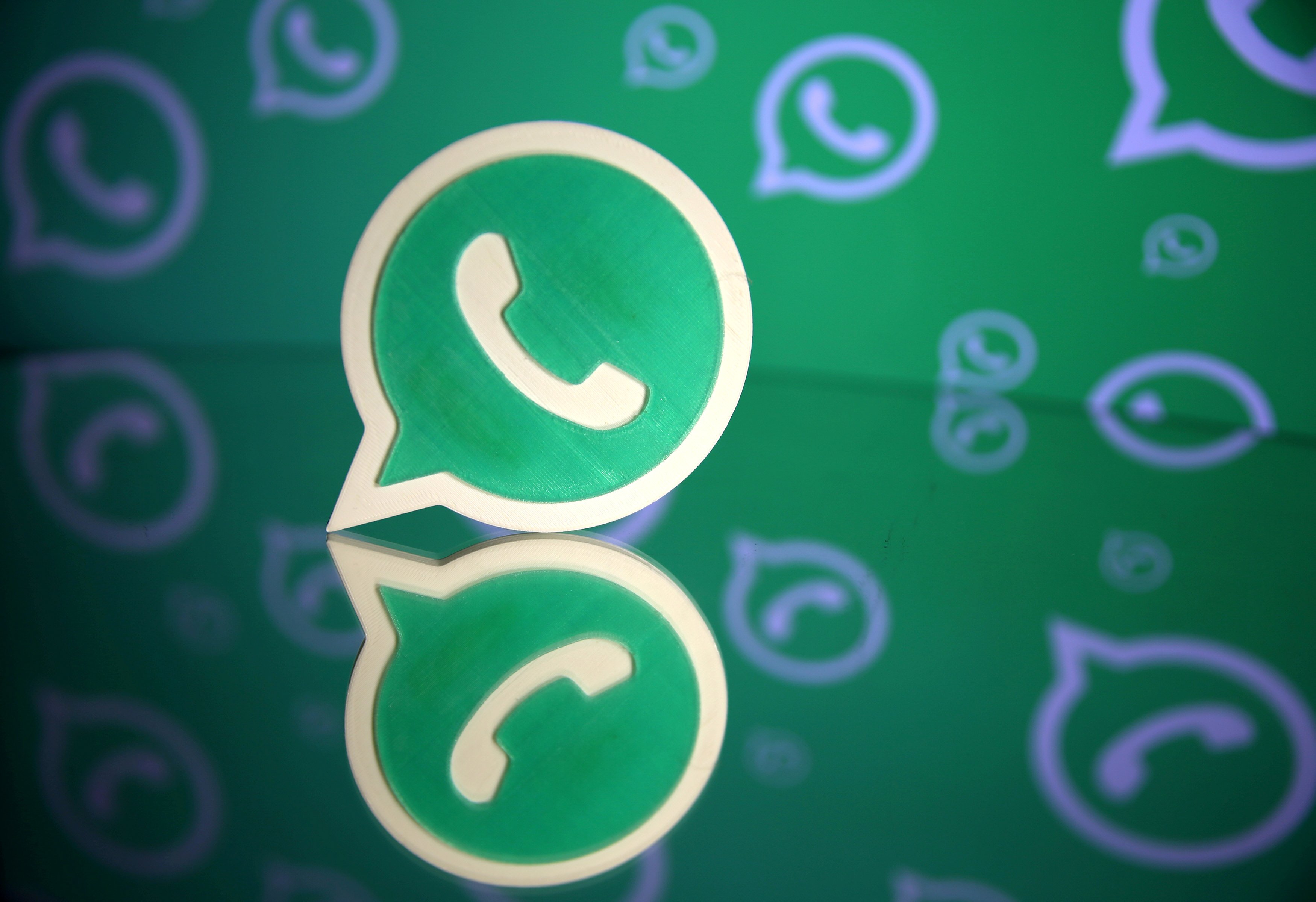 a 3d printed whatsapp logo is seen in front of a displayed whatsapp logo in this illustration september 14 2017 photo reuters