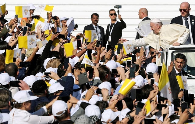 pope francis greet people as he arrives to hold a mass at zayed sports city stadium in abu dhabi photo reuters pope francis greet people as he arrives to hold a mass at zayed sports city stadium in abu dhabi photo reuters