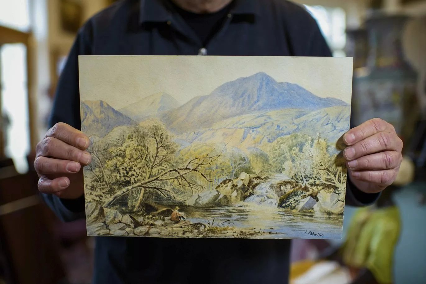 in this thursday jan 24 2019 picture an employee of an action house holds a watercolor landscape in berlin germany photo afp in this thursday jan 24 2019 picture an employee of an action house holds a watercolor landscape in berlin germany photo afp