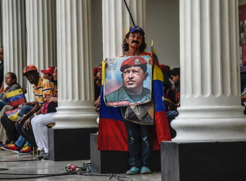 maduro loyalist holds his picture picture courtesy afp