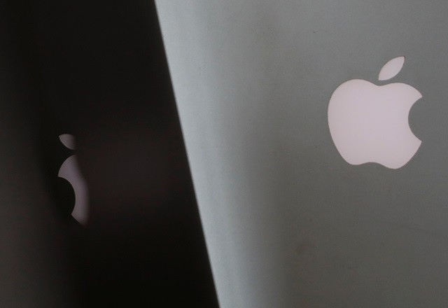 apple company logos are seen as two macbooks stand next to each other in an office in vienna austria january 3 2019 photo reuters apple company logos are seen as two macbooks stand next to each other in an office in vienna austria january 3 2019 photo reuters