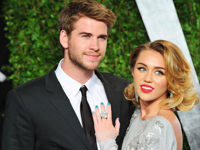 earlier miley shared an image of herself wearing a t shrit with hemsworth written on the back photo cosmopolitan