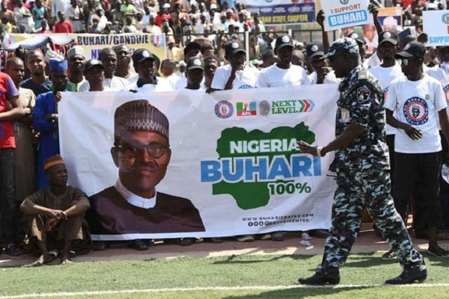 a policeman walks past a banner of the ruling all progressives congress during president muhammadu buhari 039 s campaign rally at the sanni abacha stadium in kano on january 31 2019 photo afp a policeman walks past a banner of the ruling all progressives congress during president muhammadu buhari 039 s campaign rally at the sanni abacha stadium in kano on january 31 2019 photo afp