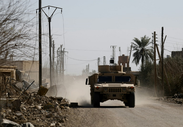 an armoured vehicle belonging to the us backed syrian democratic forces sdf near the front line village of baghouz in eastern syria on february 2 2019 photo afp