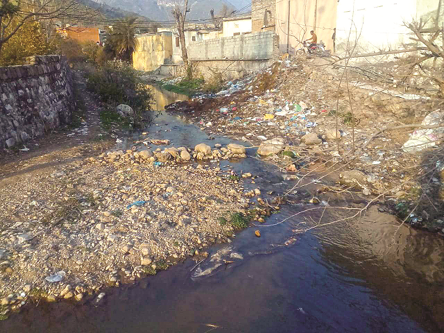 a stream in uc 2 islamabad inundated with garbage and plastic bags pollutes the water flowing into rawal lake turning it into a breeding ground for mosquitoes creating the dengue virus photo express