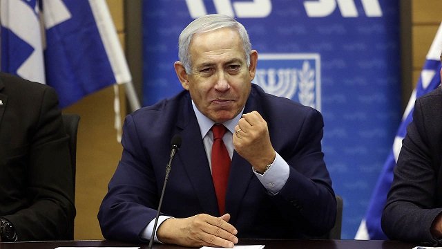 israeli prime minister benjamin netanyahu c delivers a statement at the israeli parliament in jerusalem on december 24 2018 photo afp