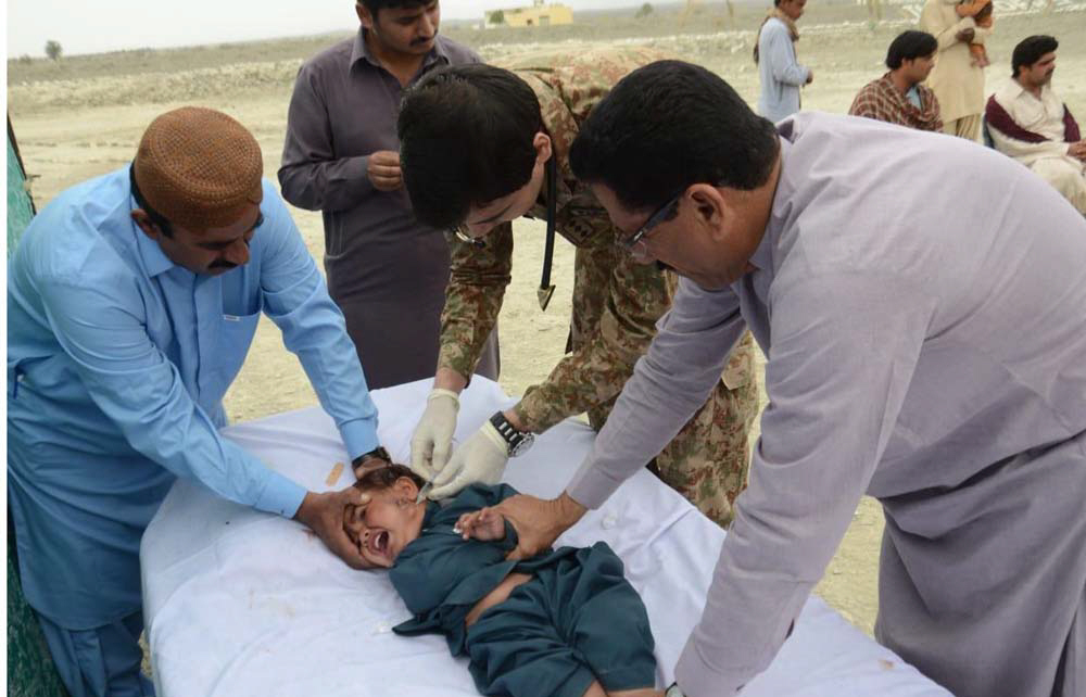 an army doctor injects vaccine into a child infected by visceral leshmaniasis at the free medical camp in awaran photo express