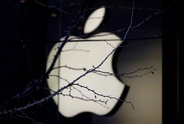 an apple company logo is seen behind tree branches outside an apple store in beijing china december 14 2018 photo reuters an apple company logo is seen behind tree branches outside an apple store in beijing china december 14 2018 photo reuters