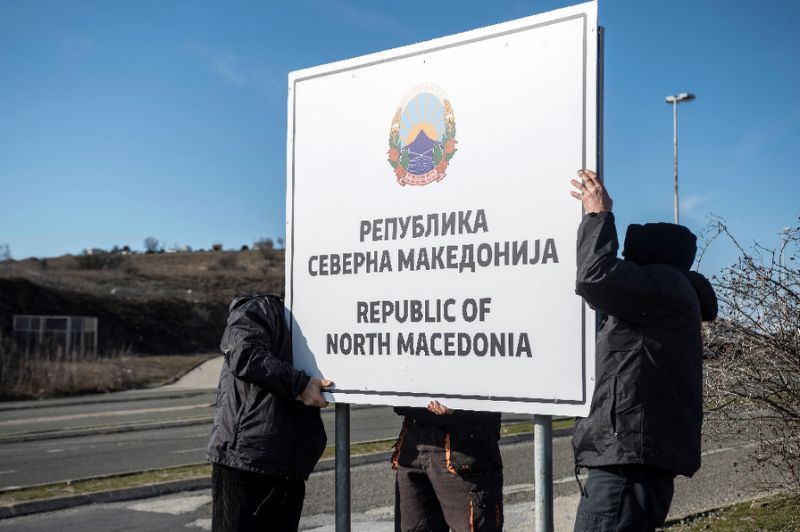 workers set up a sign reading 039 republic of north macedonia 039 at the macedonia greece border near gevgelija photo afp