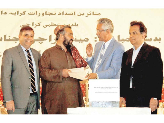 the city administration hands over allotment orders to a shopkeeper at an event on wednesday photo ppi the city administration hands over allotment orders to a shopkeeper at an event on wednesday photo ppi