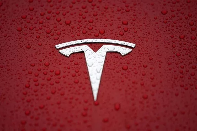 a tesla logo is seen at a groundbreaking ceremony of tesla shanghai gigafactory in shanghai china january 7 2019 photo reuters a tesla logo is seen at a groundbreaking ceremony of tesla shanghai gigafactory in shanghai china january 7 2019 photo reuters