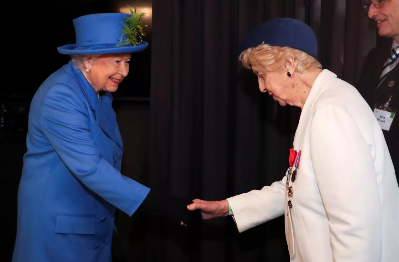 britain 039 s queen elizabeth shakes hands with bletchley park veteran ruth bourne during her visit at the watergate house photo reuters britain 039 s queen elizabeth shakes hands with bletchley park veteran ruth bourne during her visit at the watergate house photo reuters