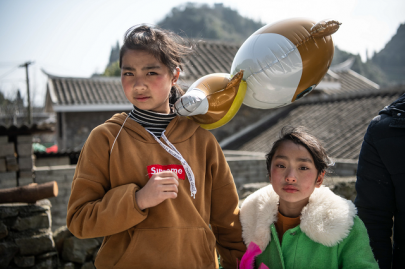 girls sport their ancestors hair for lunar new year in china