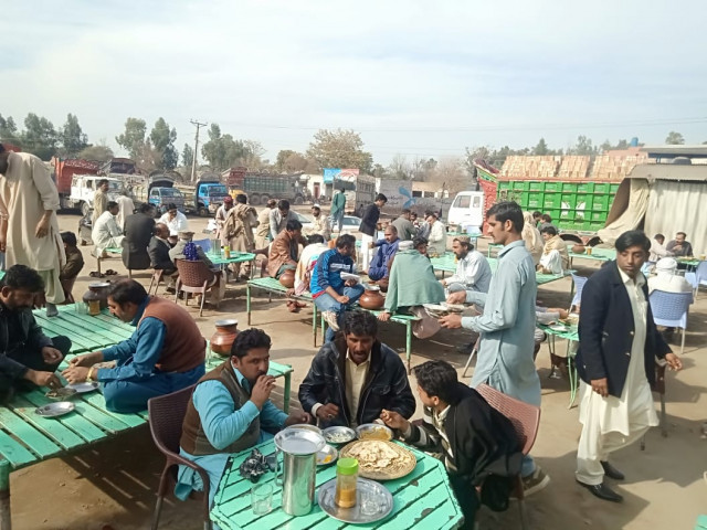 people enjoy food at the eatery photo express people enjoy food at the eatery photo express