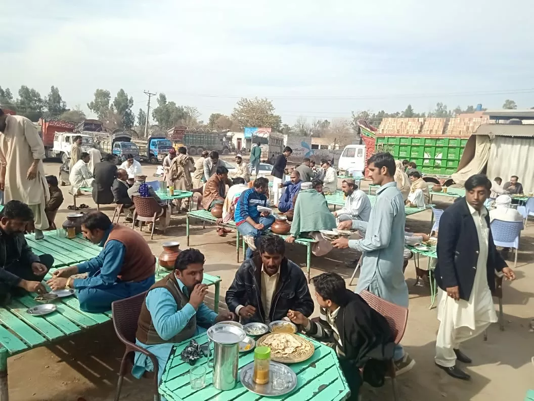 people enjoy food at the eatery photo express people enjoy food at the eatery photo express