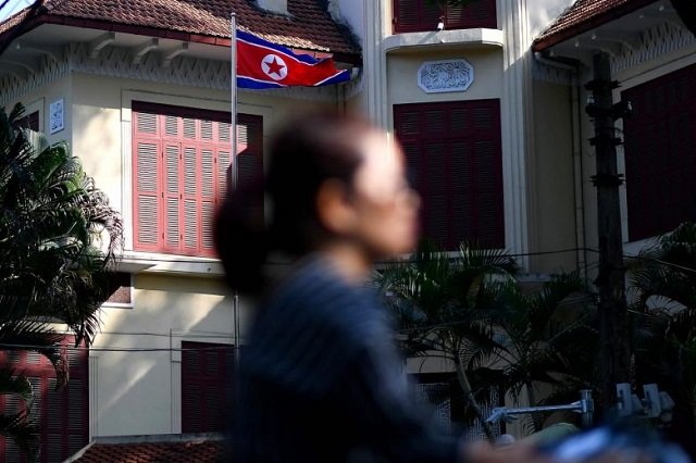 a woman rides past the north korean embassy in hanoi on feb 6 2019 the us envoy is expected to fly soon to hanoi from washington to resume talks with kim hyok chol photo afp