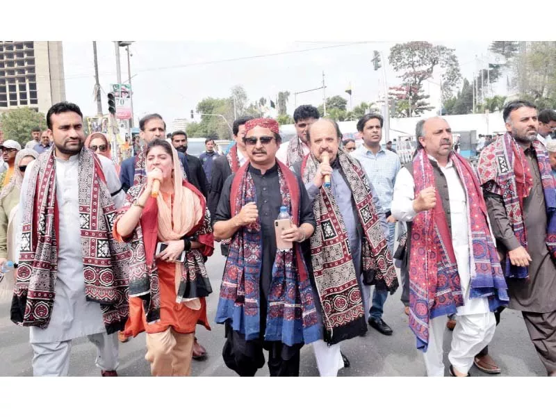 armed with ajraks and black armbands singing the national anthem pti mpas marched to the cm house on tuesday to stage a sit in protesting recent killings in the province photo ppi armed with ajraks and black armbands singing the national anthem pti mpas marched to the cm house on tuesday to stage a sit in protesting recent killings in the province photo ppi